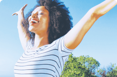 Woman outside spreading her arms