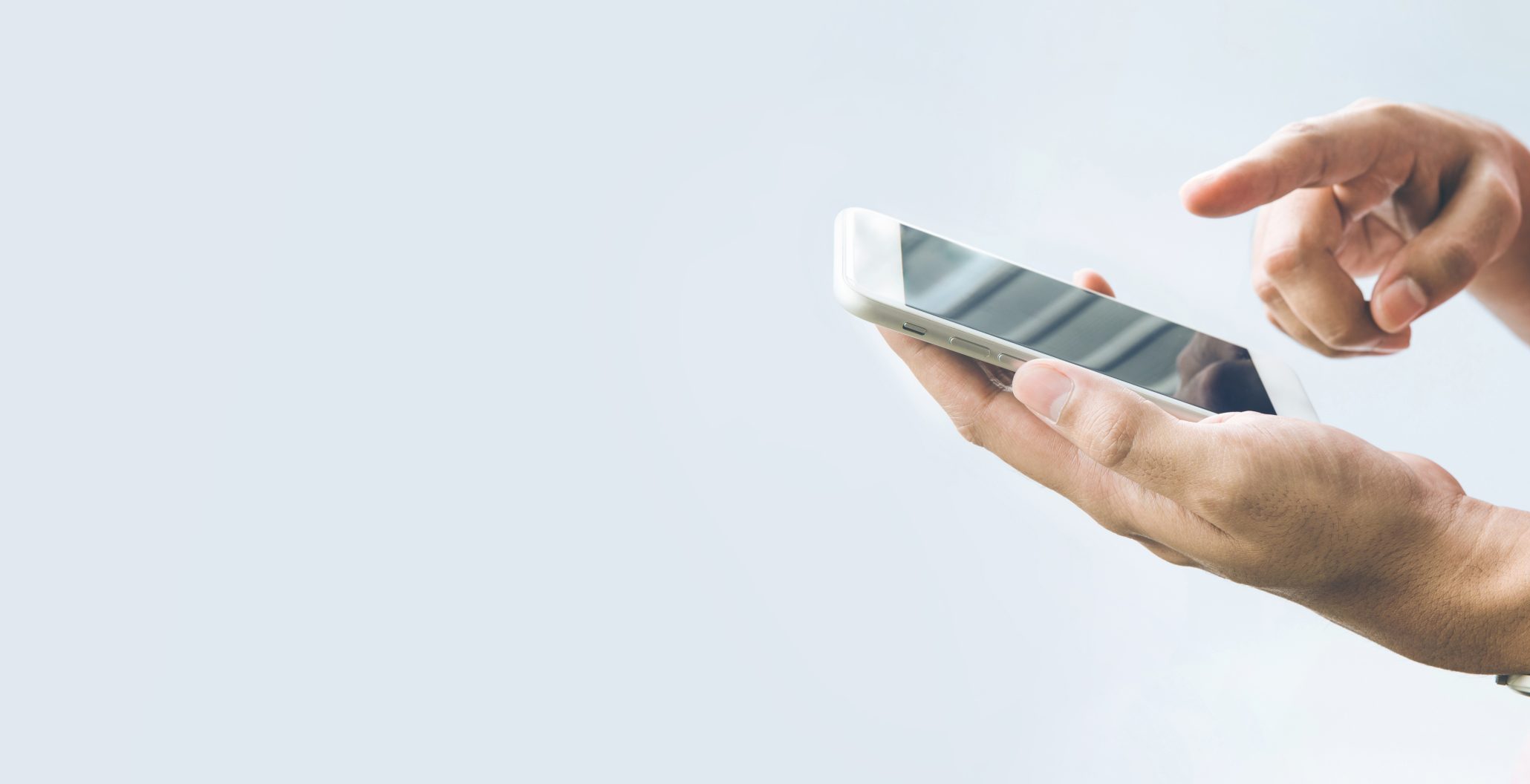 Closeup of two hands typing on a smartphone